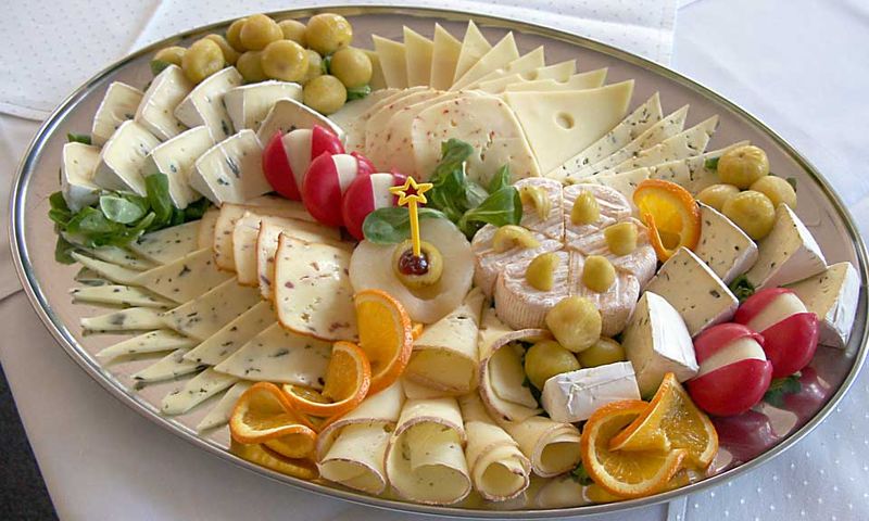 a cheese plate with several cheeses